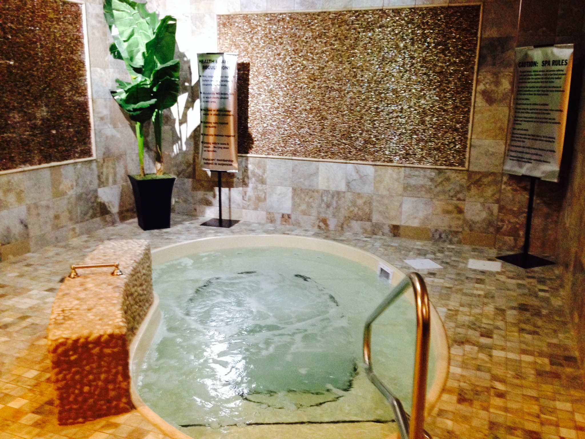 Experience serene relaxation in this San Juan fiberglass spa, featuring warm ambient lighting and elegant mosaic accents.