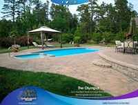 San Juan fiberglass pool in backyard with patio furniture and a person lounging